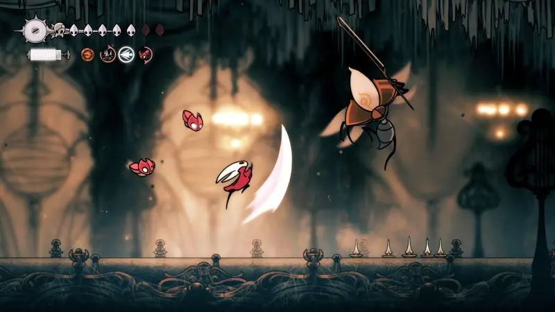 Hornet fighting through a mossy region of Pharloom in Hollow Knight: Silksong