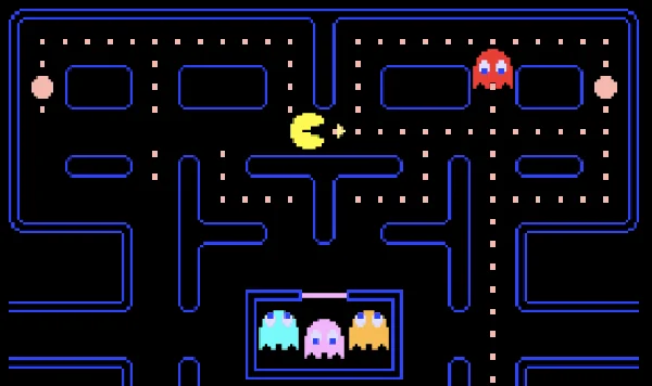 Pac-Man moving through a maze while being chased by ghosts